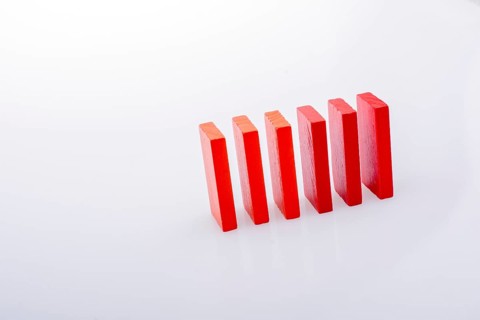 Colorful Domino Blocks in a line on a white background