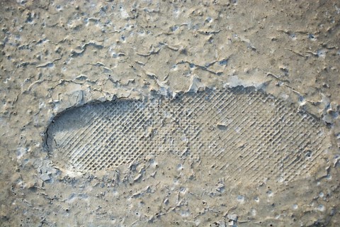 Footstep pattern seen on a concrete background