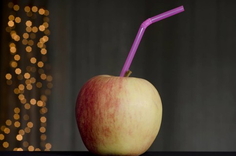Apple with straw