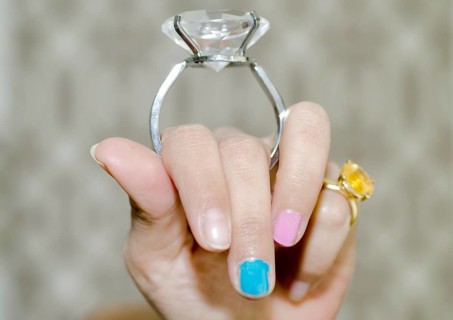 Woman Holding a Big Diamond Ring