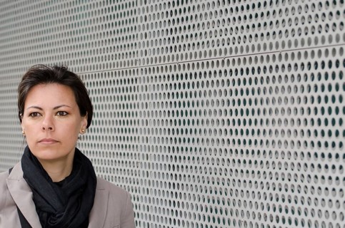 Headshot on a Self Confident Woman on Modern Design Wall