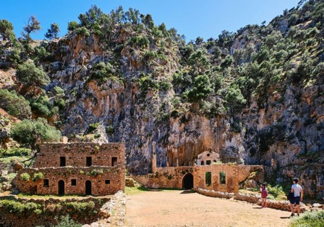 Ruins of remote abandoned Orthodox Katholiko monastery and bridge over Avlaki gorge near Gouverneto moni