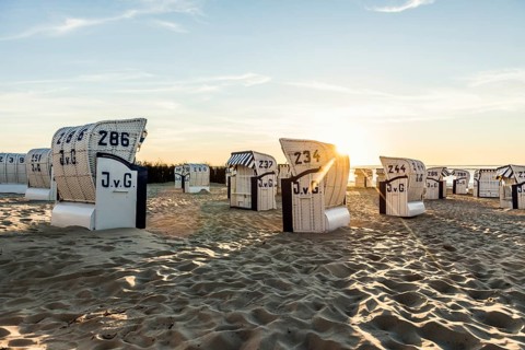 White beach chairs and mudflats