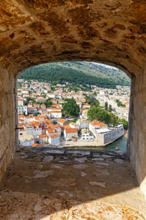 View of the old town through an opening in the wall of the fortress in Dubrovnik