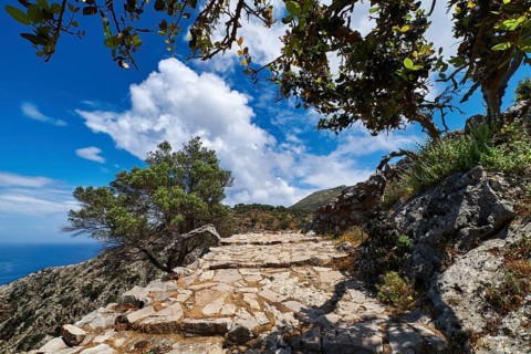 Typical Greek or Cretan landscape. Paved stairs down the hills and mountains