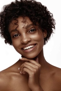 African American skincare models with perfect skin and curly hair. Beauty spa treatment concept
