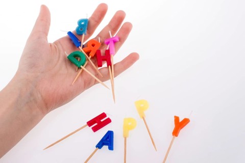 Colored envelopes and Color candles on sticks write happy