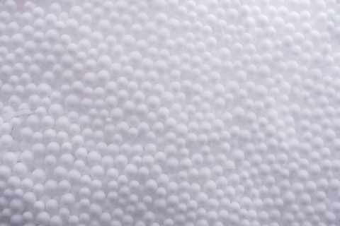White little polystyrene foam balls as background