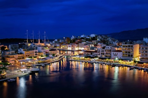 Colorful view of Voulismeni lake and Agios Nikolaos town on Crete island