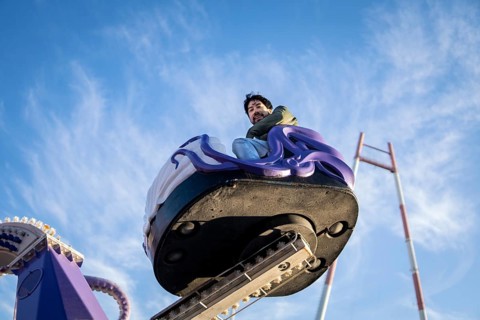 Latin man having fun at an amusement park