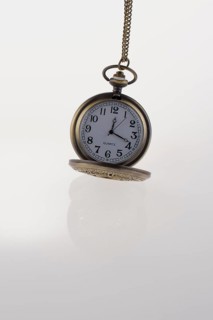 Isolated retro styled pocket watch on white background