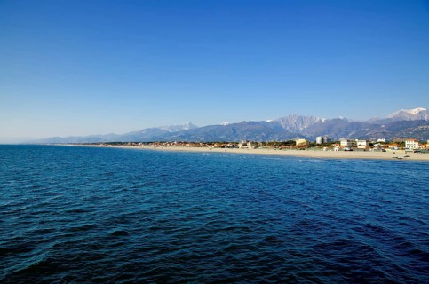 Long Sand Beach and Mountain in Tuscany