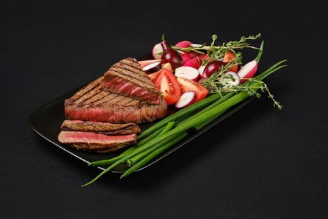 Grilled tri-tip loin beef steaks medium rare on a plate