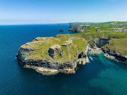 Aerial view of the rugged coastline on the Celtic Sea with the Tintagel Peninsula and the ruins of Tintagel Castle