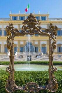 Frame and Fountain In Front of the Royal Villa of Monza with Italian Flag in a Sunny Day in Lombardy in Italy