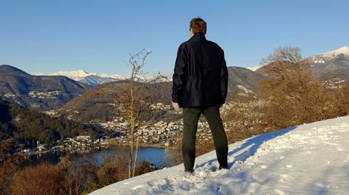 Man Enjoy Mountain View from Switzerland to Italy in a Sunny Winter Day in Collina di Oro