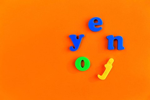 Colourful letters form the word enjoy