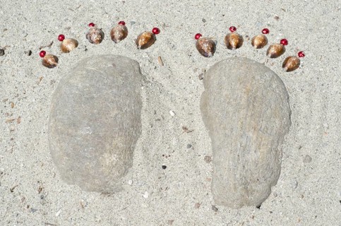Footprints Made of Stones and Pearls in the Sand