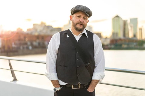 Portrait of a musician looking at camera at sunset