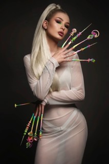 Portrait of a beautiful woman with art make-up in glamorous style