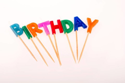 Color candles on sticks write the words birthday