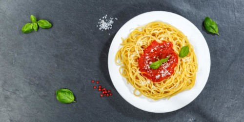 Spaghetti eating Italian pasta lunch dish with tomato sauce from above panorama on slate in Stuttgart