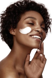 African American skincare models with perfect skin and curly hair. Beauty spa treatment concept