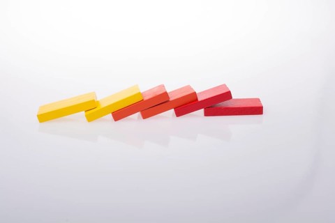 Colorful Domino Blocks in a line on a white background