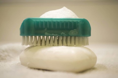 Soap and Brush Nail Cleaner in Bathroom