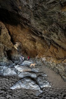 Tourists walk the fabled Merlins Cave