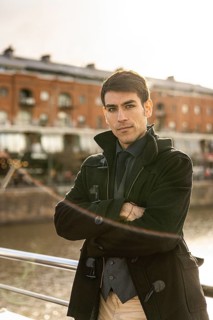 Portrait of an attractive male tourist looking at camera in Puerto Madero