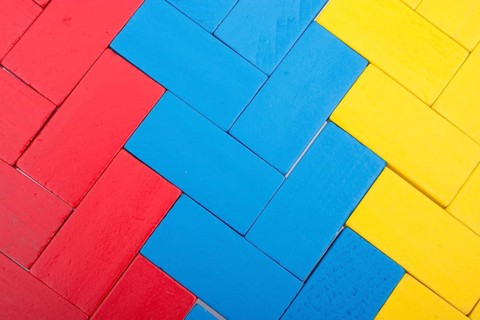 Colorful Domino Blocks in a line on a white background