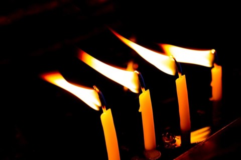 Burning candle making light in view