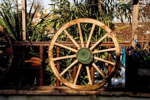 Old traditional style wagon wheel made of wood