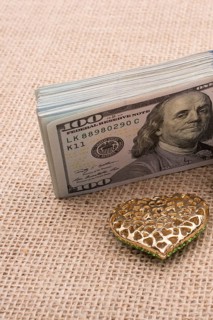 Banknote bundle of US dollar and a wedding car