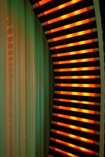 Illuminated Orange Stripes on a Modern Column in Switzerland