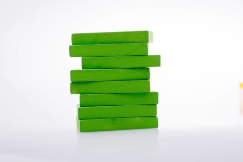 Colorful Domino Blocks in a line on a white background