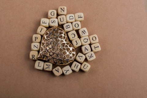 Metal Love icon and Letter cubes of made of wood
