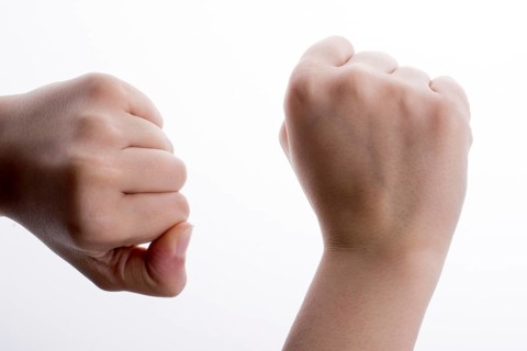 Clenched fists on a white background