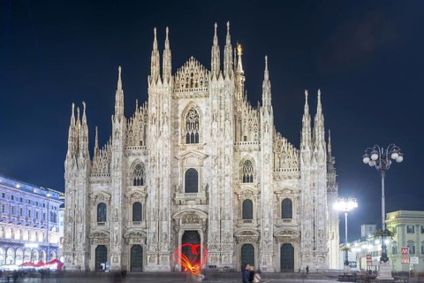 Person Light Painting a Heart Shape in Front of the Cathedral in City of Milan