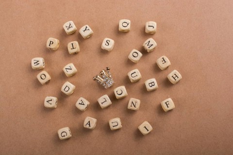 Letter cubes of Alphabet made of wood around crown