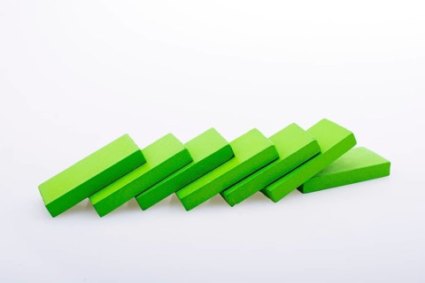 Colorful Domino Blocks in a line on a white background