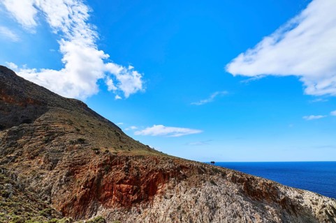 Beautiful wild red cliffs against clear blue sky