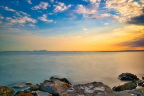 Atmospheric clouds at sunrise on Lake Constance