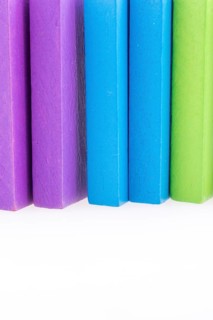 Colorful Domino Blocks in a line on a white background
