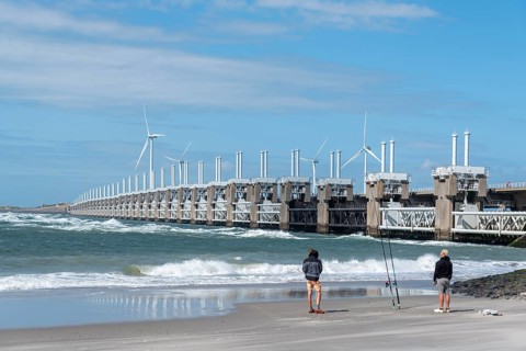 Anglers on Banjaard beach in front of the Oosterschelde barrage
