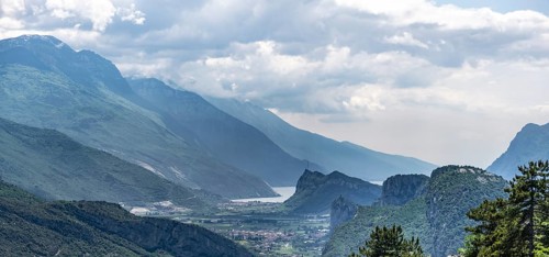 View into the Sarca Valley towards Lake Garda with rocks of Castello di Arco