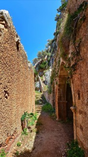 Walkway in ruins of remote abandoned Katholiko monastery in Avlaki gorge of Akrotiri peninsula