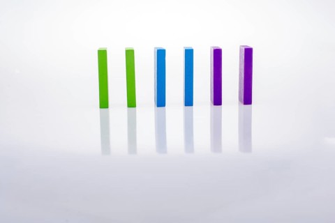 Colorful Domino Blocks placed on a white background