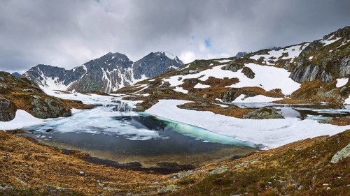 Half-frozen mountain lake